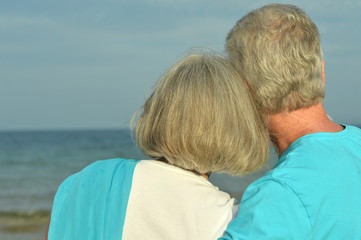 Poster - elderly couple rest at tropical beach