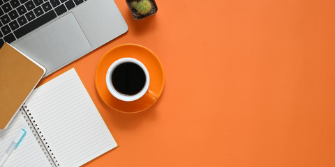 Fototapete - Top view image of Colorful working table. Flat lay Computer laptop, Cactus, Notebook, Diary, Pen and Coffee cup. Colorful workplace concept.
