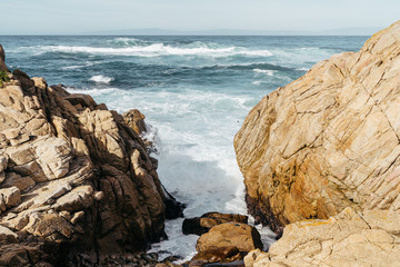 Waves Crashing Between Boulders