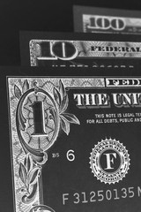 Wall Mural - us banknotes of 1, 10 and 100 dollars. close-up denomination figures. american economy, exchange rat