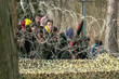 Abstract, blurry, out of focus image for media and internetа. A group of unorganized people are trying to illegally cross the border.