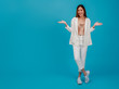 © bunditinay - Asian beautiful business women blogger are posture with hand.Full length standing isolated on blue color background with copy space.Concept of online shopping business with Promotion and Sale.