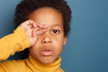 Wall Mural - Black child boy crying. Unhappy African American kid face