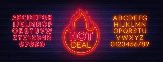 Poster - Hot deal neon sign. Neon alphabet on brick wall background.