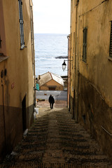 Wall Mural - Cervo (IM), Italy - December 30, 2017: A tipycal road and houses in Cervo village, Italian Riviera, Imperia, Liguria, Italy