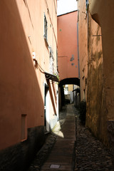 Wall Mural - Cervo (IM), Italy - December 30, 2017: A tipycal road and houses in Cervo village, Italian Riviera, Imperia, Liguria, Italy