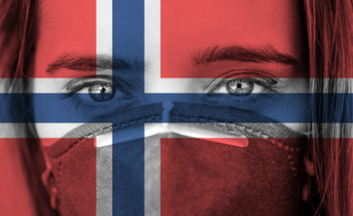 Closeup photo of woman's eyes wearing protective mask against the background of the Norway flag. 