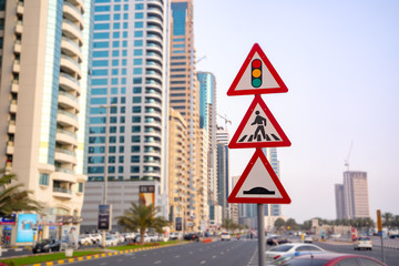 Traffic Light Sign. A road sign warning of a traffic light ahead. Speed Bump. Pedestrian crossing  and speed bump sign traffic signs on the street