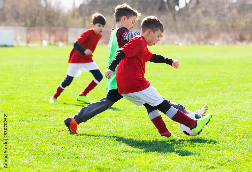 Boys play soccer sports field - obrazy, fototapety, plakaty 