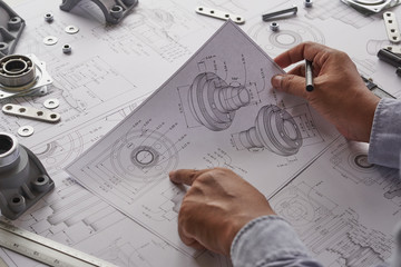 Poster - Engineer technician designing drawings mechanical parts engineering Engine.manufacturing factory Industry Industrial work project blueprints measuring bearings caliper tools