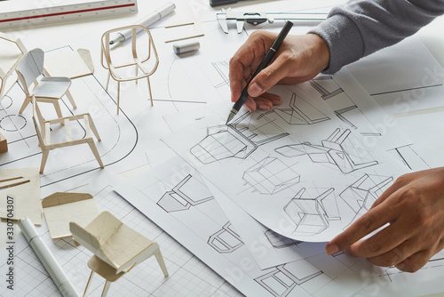 Designer sketching drawing design development product plan draft chair armchair Wingback Interior furniture prototype manufacturing production. designer studio concept .
