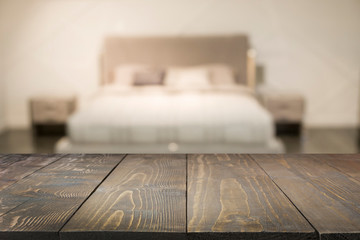 Wall Mural - Empty wooden board and blurred modern bedroom with house interior as background. Abstract pattern.