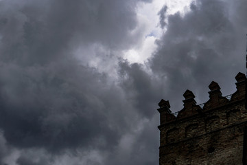 Wall Mural - terrible thunderclouds from the side of a plane. gloomy epic clouds. background image in a dark gray