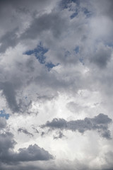 Wall Mural - terrible thunderclouds from the side of a plane. gloomy epic clouds. background image in a dark gray