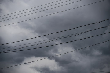 Wall Mural - terrible thunderclouds from the side of a plane. gloomy epic clouds. background image in a dark gray