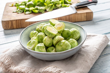 Wall Mural - Fresh brusseles sprouts in bowl on kitchen table