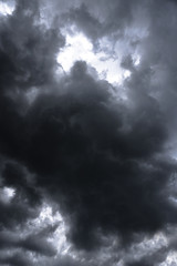 Wall Mural - terrible thunderclouds from the side of a plane. gloomy epic clouds. background image in a dark gray