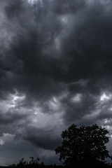 Wall Mural - terrible thunderclouds from the side of a plane. gloomy epic clouds. background image in a dark gray
