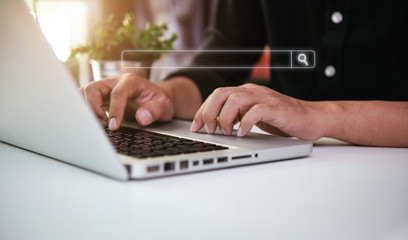 Male business clicking internet search page on computer touch screen in office.