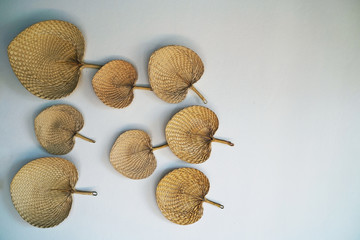 Wall Mural - Wicker plate shape of leaves on the wall.