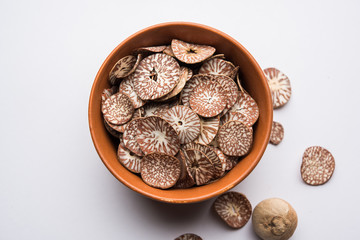 Wall Mural - Betel nut chips in a bowl also known as slices of supari in india, used in Paan masala