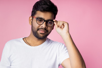 Sticker - Portrait of handsome Indian guy standing on pink background