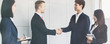 © khwanchai - successful negotiate and handshake concept, two businessman shake hand with partner to celebration partnership and teamwork, business deal.