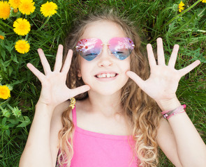 Child at summer with dandelion