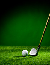 Golf Club And Golf Ball On The Turf