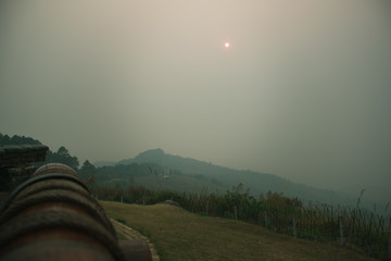 Wall Mural - the sunset in the evening and full of haze from burning forests
