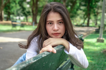  Beautiful Asian women with long hair wearing a white shirt. White bug hat, jeans showing emotions In the nature park-09.jpg, Asian beautiful woman with yellow skin, long black hair, wearing a white s