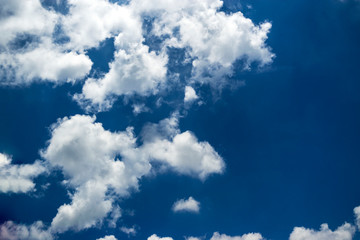 white clouds with blue skies