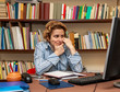 © Provisualstock.com - Image of a busy woman teleworking at her desk at the home. Working at home became an important recommendation during the coronavirus outbreak in the beginning of 2020