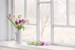 beautiful tulips on old white windowsill