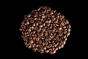 fresh aromatic coffee beans on a black background