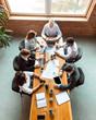 © Prostock-studio - Diverse Coworkers Working Using Computers Sitting At Desk In Office