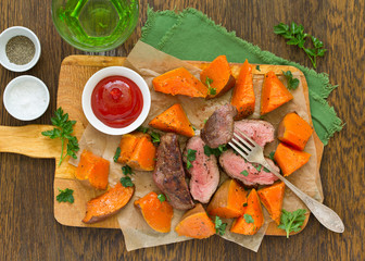 Wall Mural - Roast beef with baked pumpkin.