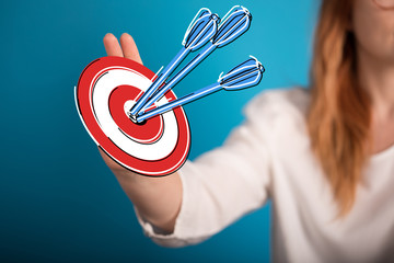 Aufkleber -  makes a dart throw on the target. The concept of persistence in business..