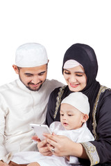 Wall Mural - Muslim boy and his parents using a cellphone