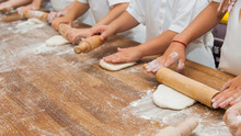 Young Children Make Dough Products. Hands Closeup