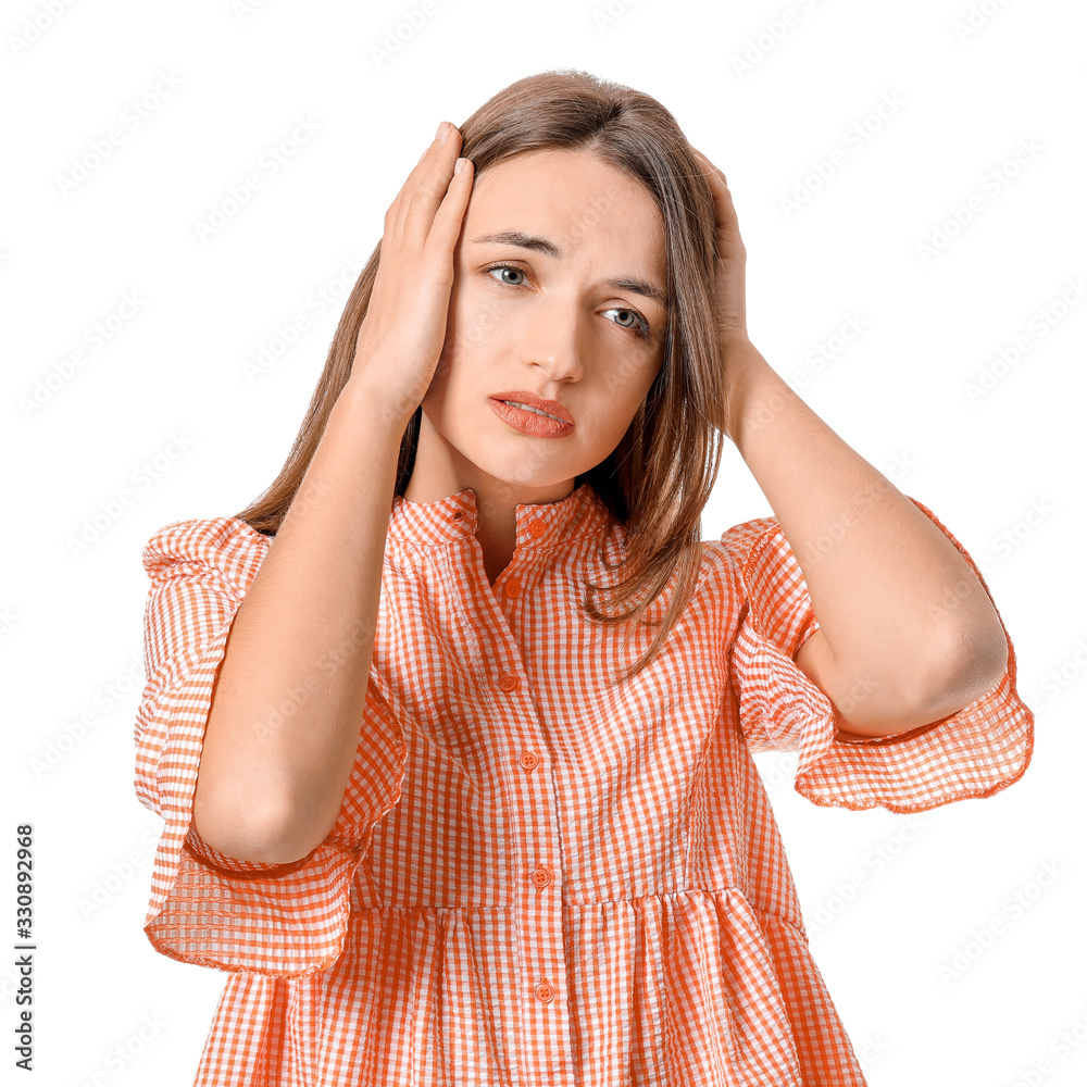 Sad young woman on white background