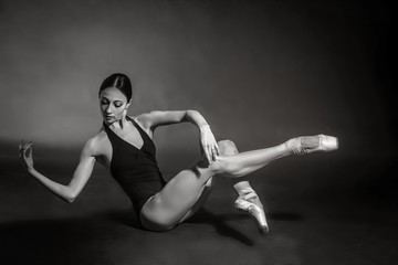 black and white vintage dramatic portrait of a dancing girl-ballerina