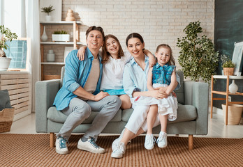 Wall Mural - Two children with mother and father.