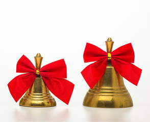 Wall Mural - Christmas bell with a red bow isolated on white background