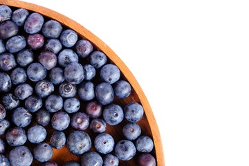 fresh blueberries in Wooden tray isolated on white background.