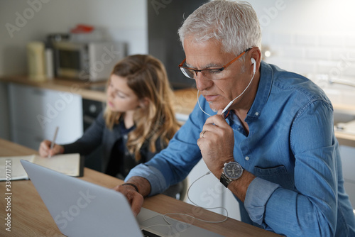 Fotomural Father and school-girl working form home, telework and e-learning