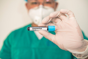 Coronavirus 2019-nCoV Blood Sample. Corona virus outbreaking. Corona Virus in Lab. Scientist hold a tube with Blood Test and Barcode with the Virus Name Coronavirus . New Epidemic Corona Virus