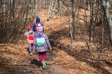 portrait of family on hiking forest trip with hiking clothes.