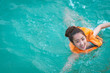 © etemwanich - in relaxing time with girl play sea by wearing Life jacket