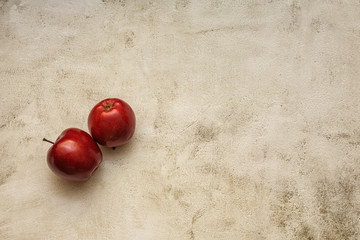 two red apples located side by side